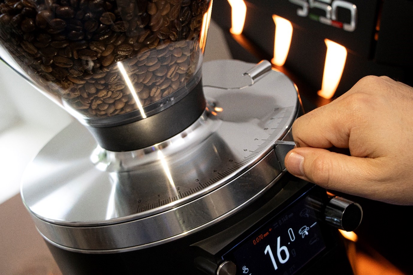 Adjusting coffee grinder